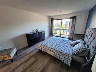 a bedroom with a bed and a dresser and a window at (B27) Cozy & Serene Private LA Studio in Los Angeles