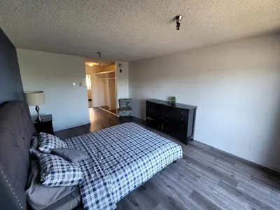 a bedroom with a bed and a dresser at (B27) Cozy & Serene Private LA Studio in Los Angeles