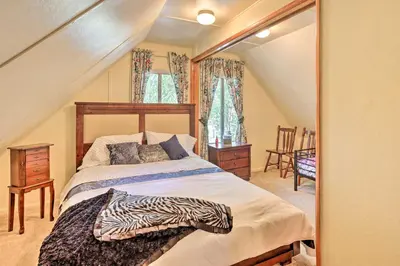 a bedroom with a bed with a zebra blanket on it at Cozy Crestline Cabin, Close to Lakes, Parks! in Crestline