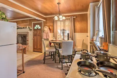 a kitchen with a table with pots and pans on it at Cozy Crestline Cabin, Close to Lakes, Parks! in Crestline