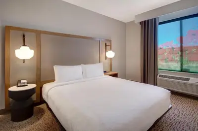 a hotel room with a large bed and a window at Fairfield Inn & Suites Lancaster Palmdale in Lancaster