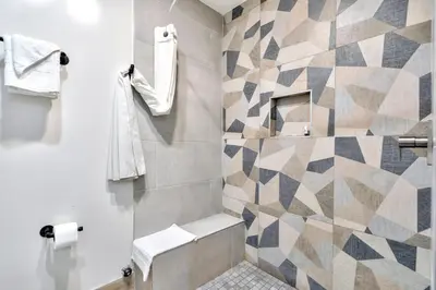 a bathroom with a toilet and a shower at Royal Hawaiian Inn - Mid City, Los Angeles in Los Angeles