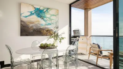 a dining room with a table and chairs at Matador by AvantStay Ocean Front Malibu Pad w Rooftop Patio in Topanga