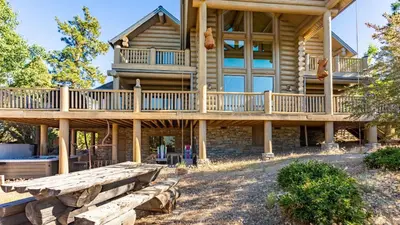 a large log home with a large deck at Hot Tub Game Room Large Deck w Incredible View Penticton Lodge by AvantStay in Big Bear Lake