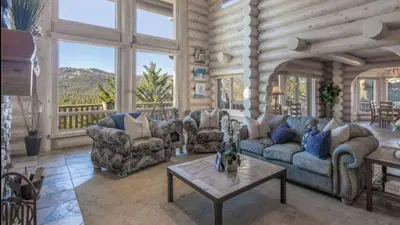 a living room with couches and a table at Hot Tub Game Room Large Deck w Incredible View Penticton Lodge by AvantStay in Big Bear Lake