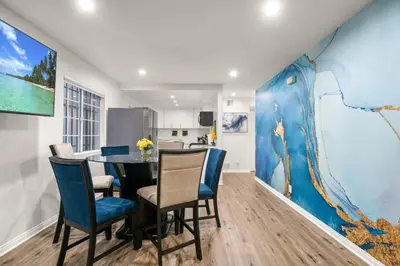 a kitchen and dining room with a table and chairs at The Avalon - 35 Percent Off March! in Los Angeles