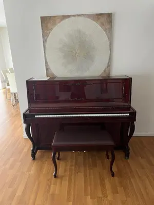 a brown piano sitting in a room with a mirror at Modern spacious home close to Universal studio & Hollywood for 11 in Los Angeles