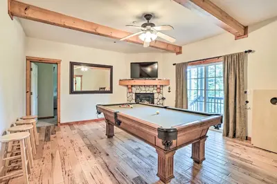 a pool table in a living room with a ceiling at Spacious Lake Arrowhead Home with Putting Green in Lake Arrowhead