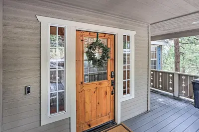 a front door of a house with a wreath on it at Spacious Lake Arrowhead Home with Putting Green in Lake Arrowhead