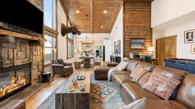 a living room with a couch and a fireplace at Teddy by AvantStay Majestic Cabin in Big Bear w Balcony in Big Bear Lake