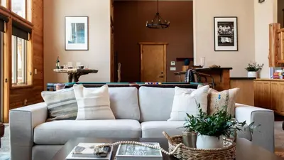 a living room with a couch and a table at Bernard by AvantStay Luxurious Cabin in Big Bear w Hot Tub Pool Table in Big Bear Lake