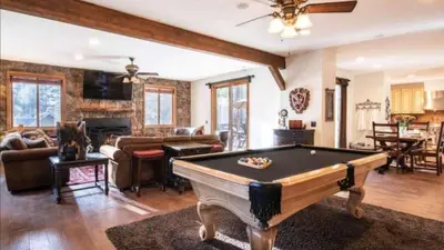 a living room with a pool table in it at Big Bear Castle by AvantStay Private Home in Great Big Bear Location w Hot Tub in Big Bear Lake