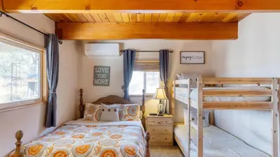 a bedroom with bunk beds in a tiny house at 50 yards to Lake Boulder Bay • Pool Table Lakeside in Bearadise by AvantStay in Big Bear Lake