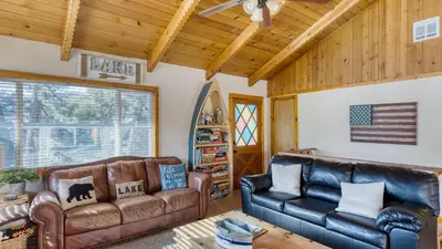 a living room with two leather couches at 50 yards to Lake Boulder Bay • Pool Table Lakeside in Bearadise by AvantStay in Big Bear Lake