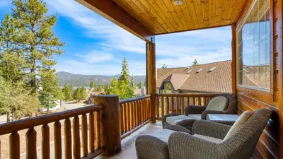 a balcony with chairs and a view of the mountains at Zen Den by AvantStay Entertainers Home in Ideal Big Bear Location w Hot Tub in Big Bear Lake