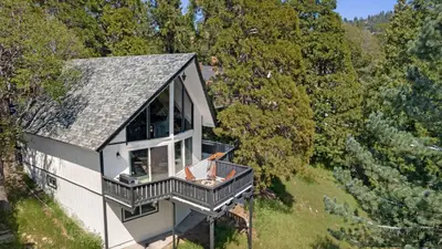 an overhead view of a house with a balcony at Hot Tub Fire Pit Deck Views Near the Lake The Matterhorn Manor by AvantStay in Crestline