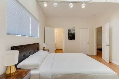 a bedroom with a large bed and a window at 5 Bedroom Koreatown Charmer near DTLA in Los Angeles