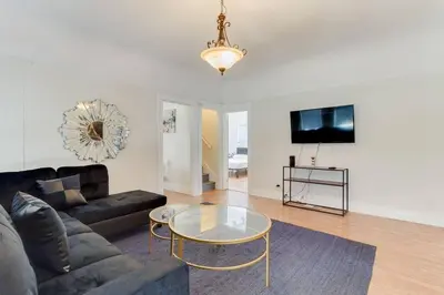 a living room with a couch and a glass table at 5 Bedroom Koreatown Charmer near DTLA in Los Angeles