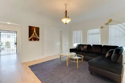 a living room with a couch and a table at 5 Bedroom Koreatown Charmer near DTLA in Los Angeles