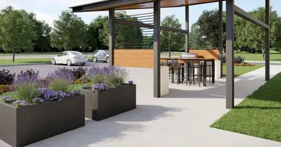 a pavilion with flowers and a car parked in a parking lot at Candlewood Suites - Loma Linda - San Bernardino S by IHG in Loma Linda