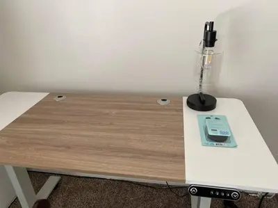a table with a phone on top of it at Revitalizing 3 Bedroom Home With Pool, Pet-Friendly, Wi-fi in Bakersfield