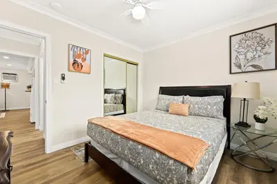 a bedroom with a bed and a glass table at Bright & Cozy Getaway-10min to Downtown LA in Alhambra