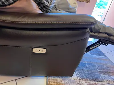 a black suitcase sitting on top of a chair at Frazier View Motel in Frazier Park