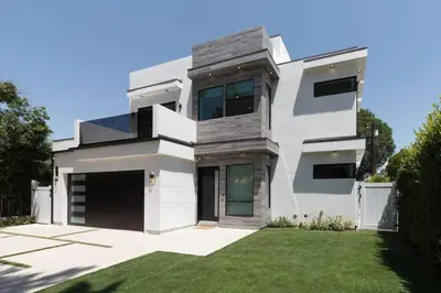 a white house with a yard at Posh Luxury Modern Home with Pool Spa and Rooftop Deck in Encino