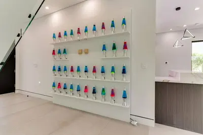 a wall of colorful glass vases in a room at Posh Luxury Modern Home with Pool Spa and Rooftop Deck in Encino