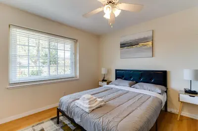 a bedroom with a large bed and a ceiling fan at 4 Bedroom West Hills Charmer with Pool and Jacuzzi in Los Angeles