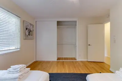 a room with a bed and a closet and a door at 4 Bedroom West Hills Charmer with Pool and Jacuzzi in Los Angeles