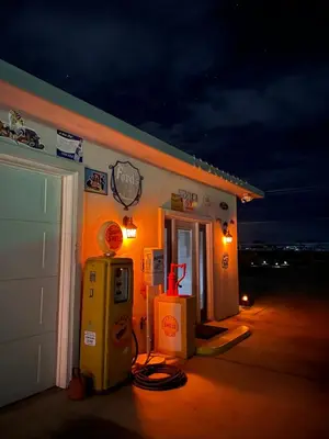 a gas station with a payphone in front of it at My Oasis in Bakersfield