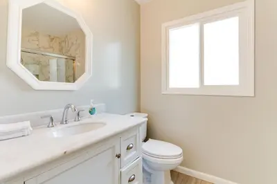 a white bathroom with a sink and a toilet at Valley Modern Glam Charmer in Reseda