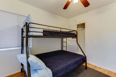a bedroom with two bunk beds and a ceiling at New 4 bedroom Modern Villa in Mar Vista in Los Angeles