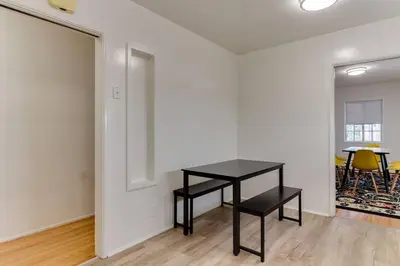 a black table in a white room with a table at New 4 bedroom Modern Villa in Mar Vista in Los Angeles