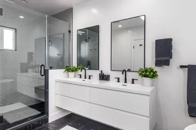 a white bathroom with two sinks and a shower at 4 Bedroom house large pool & spa in prime location in Los Angeles