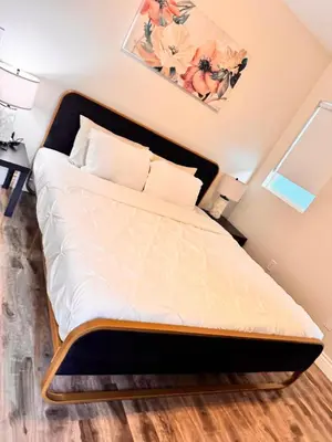 a large bed in a room with at Lake Balboa Modern 4 Bedroom 3 Bath Glam Charmer in Raymer