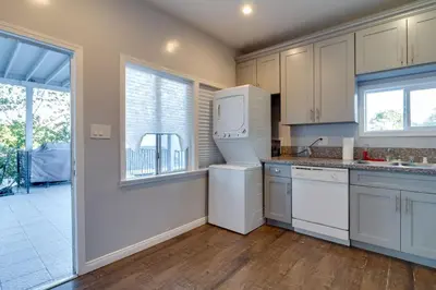 a kitchen with a white refrigerator and a window at Cozy 3 bedroom San Fernando Valley in San Fernando