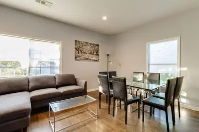 a living room with a couch and a glass table at Cozy 3 bedroom San Fernando Valley in San Fernando