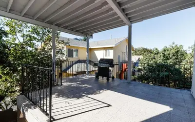 a patio with a grill and a fence at Cozy 3 bedroom San Fernando Valley in San Fernando