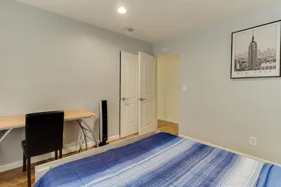 an empty room with a desk and a chair at 4 bedroom house with a pool in Reseda