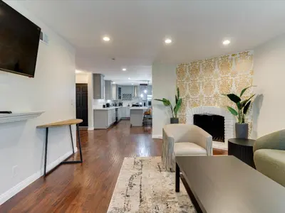 a living room with a couch and a fireplace at Woodland Hills Zen Modern in Woodland Hills