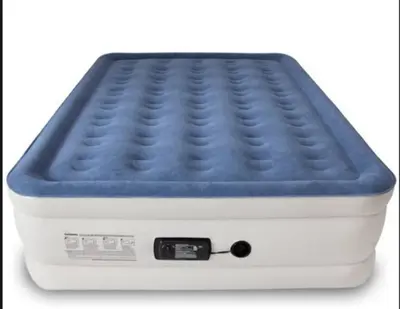 a mattress with a blue top on top at Woodland Hills Zen Modern in Woodland Hills