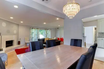 a dining room with a large wooden table and chairs at Woodland Hills Charmer in Los Angeles