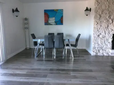 a dining room with a table and four chairs at 5 bedroom 3 bath home near universal in Sherman Oaks