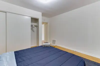 a bedroom with a large blue bed in a room at 2 Bedroom Mid-Wilshire Charmer close to Downtown in Los Angeles