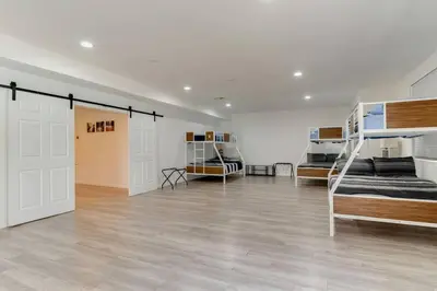 a large room with two bunk beds in it at Large 5 bedroom charmer wIth pool in Los Angeles