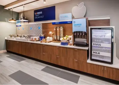 an apple store with a counter with anasteryasteryasteryasteryasteryasteryasteryastery at Holiday Inn Express & Suites Hawaiian Gardens by IHG in Hawaiian Gardens