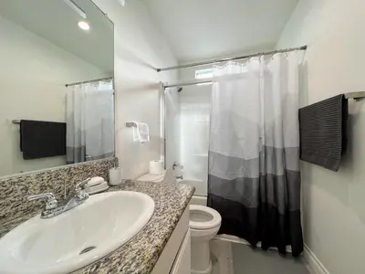 a bathroom with a sink and a toilet at Hollywood Black Habitat in Los Angeles