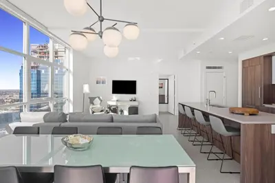 a living room with a couch and a table at Level Los Angeles - Downtown Flower in Los Angeles